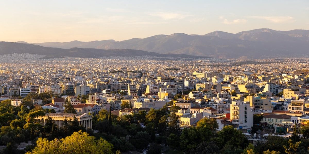 a city with mountains in the background