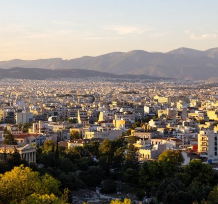 a city with mountains in the background