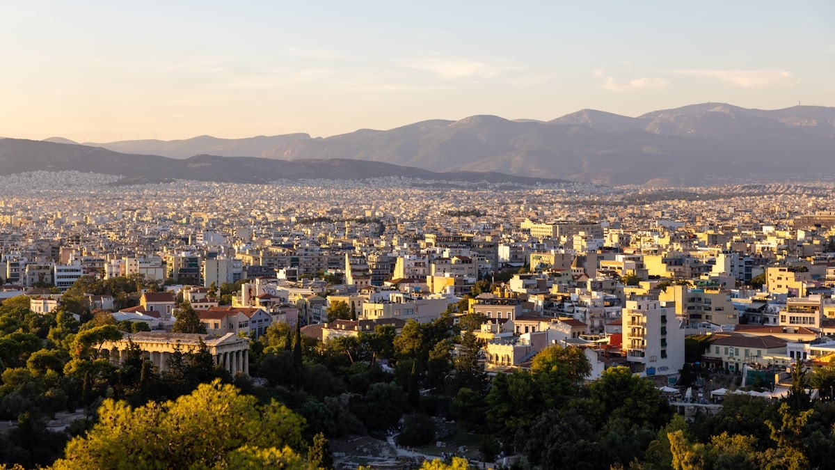 a city with mountains in the background